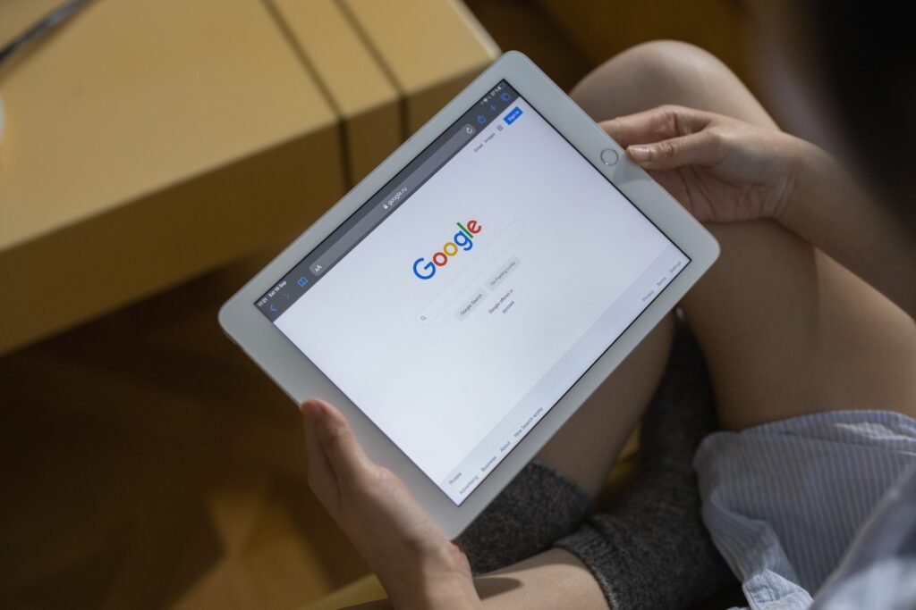 A Person Holding White Ipad Mini